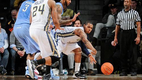 Georgia Tech forward Marcus Georges-Hunt (3) gets a pass off to forward Kammeon Holsey (24) as North Carolina defends during an NCAA college basketball game, Wednesday, Jan. 29, 2014, in Atlanta. North Carolina won 78-65. (AP Photo/John Amis) As Atlanta recovered from a snowstorm that wreaked havoc across the region, North Carolina thrashed Georgia Tech 78-65 at McCammish Pavilion in Atlanta. (John Amis / AP)