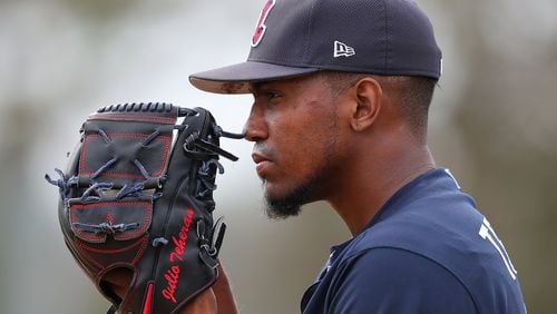 Braves Julio Teheran prepares to throw a pitch while pitchers and catchers hold their first spring training workout on Feb. 15. Curtis Compton/ccompton@ajc.com