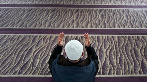 A Muslim man prays in a mosque in Amsterdam, Netherlands, (AP Photo/Muhammed Muheisen)
