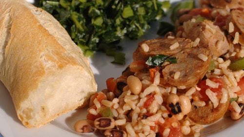 080130 Atlanta, Ga: Hoppin-laya (sausage, tomatoes,beans and rice) with collard greens and bread  for five.0313fd  (CHRIS HUNT/STAFF) styling by Jeanne Besser