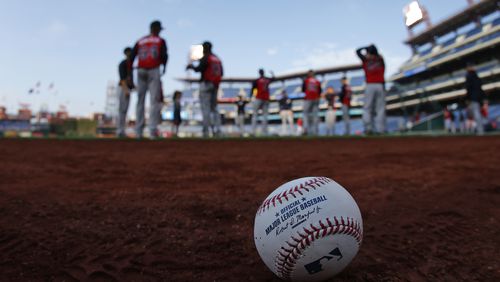 The Atlanta Braves warm up before a game against the Philadelphia Phillies April 21, 2017, at Citizens Bank Park in Philadelphia.