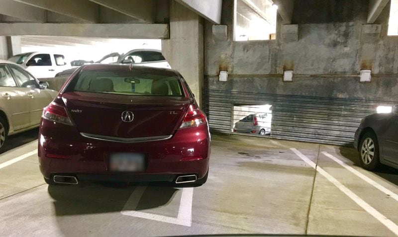 Another two-spot parking hog photographed by AJC state government writer and editor James Salzer, who posts the pics on Twitter with the hashtag #ParkingIzHard. Photo by James Salzer