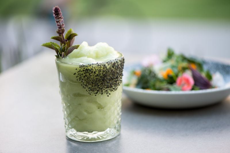 The Frozen Avocado Margarita at Cold Beer comes with Beautiful Briny Sea’s black Gunpowder salt down the side of the glass. CONTRIBUTED BY MIA YAKEL