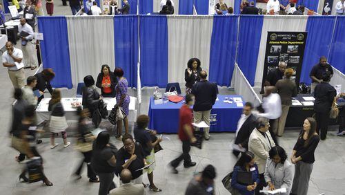 Hiring at job fairs like this one was weaker in June, but the jobless rate still dropped a bit.