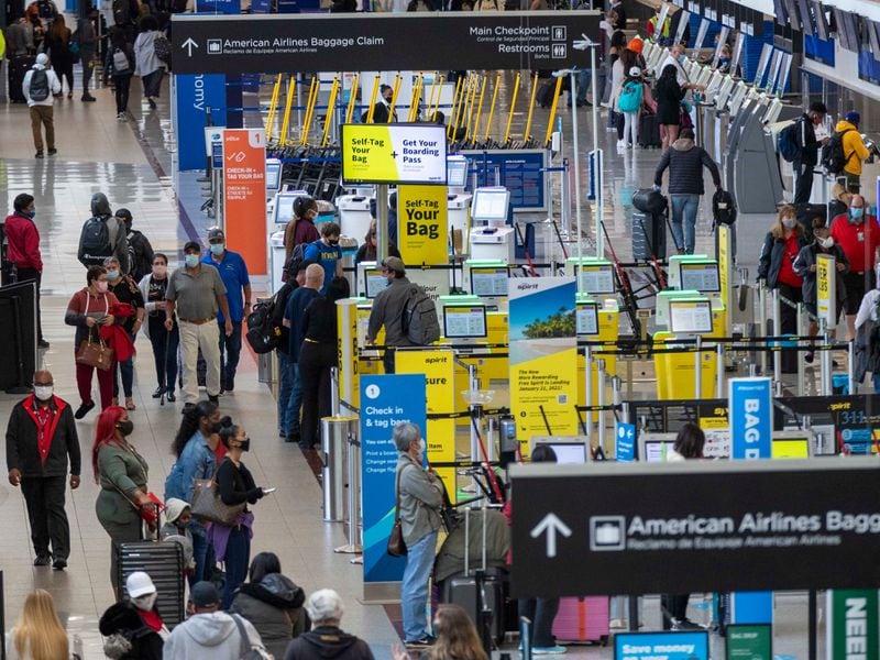 Airport guests crowd the North Domestic Terminal at Hartsfield-Jackson  International Airport in Atlanta on Monday, November 23, 2020.  (Alyssa Pointer / Alyssa.Pointer@ajc.co)