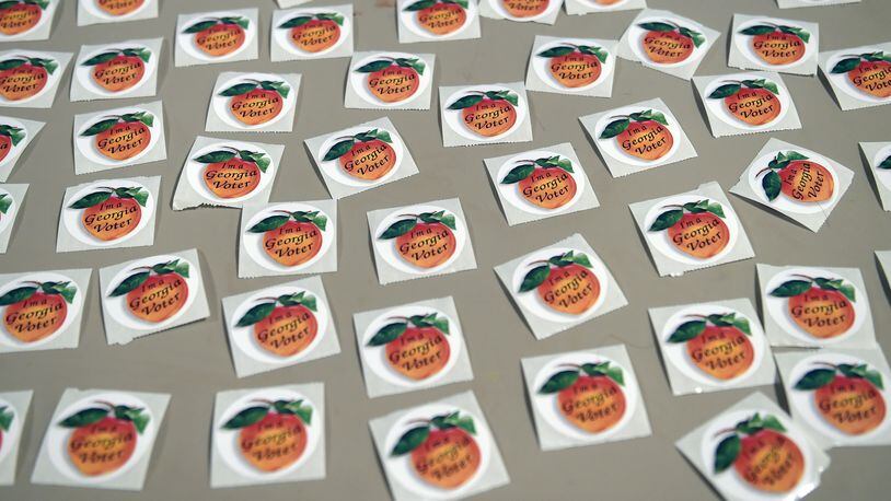 Voting stickers await DeKalb County voters at the polls on Election Day at the Crossroads Presbyterian Church in Stone Mountain on Tuesday. Kent D. Johnson, kdjohnson@ajc.com