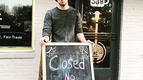 Benjamin Mitchell, a barista at Banjo Coffee, shows the sad face that customers experienced Wednesday and Thursday when the Avondale shop was temporarily closed, due to DeKalb County’s “boil water” advisory. On Friday Banjo reopened, with water “imported” from Fulton County. Photo: courtesy Banjo Coffee
