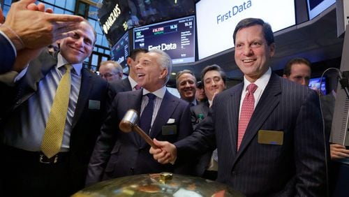 Atlanta’s First Data Corp. said it is providing free mobile payments devices to help Houston-are businesses recover from Hurricane Harvey. First Data CEO Frank Bisignano is shown ringing the bell at the company’s first day on the New York Stock Exchange in 2015. (AP Photo/Richard Drew)