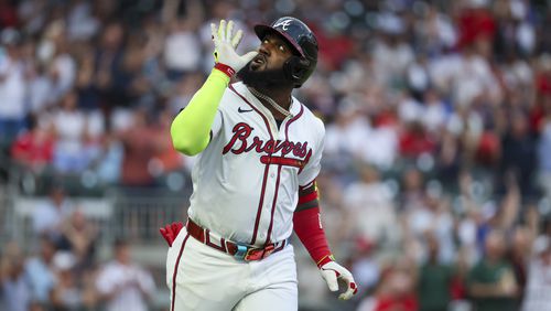 Atlanta Braves' Marcell Ozuna (20) reacts after hitting a three-run home run against the Boston Red Sox during the first inning of a baseball game Wednesday, May 8, 2024, in Atlanta. (Jason Getz/Atlanta Journal-Constitution via AP)