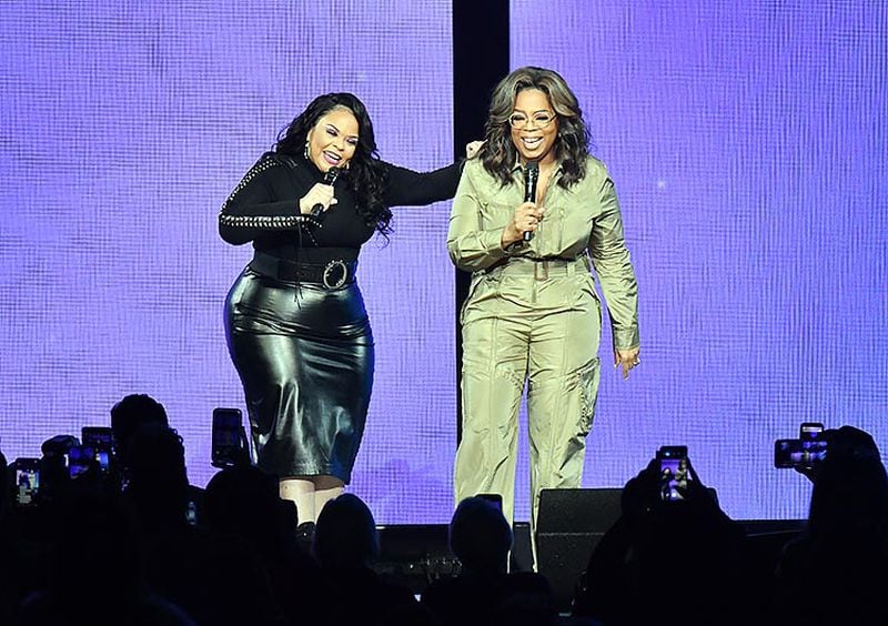 January 25, 2020 Atlanta - Oprah Winfrey shares a laugh with gospel singer Tamela Mann during Oprah's 2020 Vision Tour at State Farm Arena on Saturday, January 25, 2020. Today, Oprah Winfrey took the stage for the fourth stop of her national arena tour, OprahâÃÃ´s 2020 Vision: Your Life in Focus. Presented by WW (Weight Watchers Reimagined), Oprah is bringing a full day wellness event to nine U.S. cities through March 7. Joined by high profile guests including a marquee interview with Dwayne Johnson, Oprah will help motivate audiences to make 2020 the year of renewal and celebrate all we are meant to be. (Hyosub Shin / Hyosub.Shin@ajc.com)