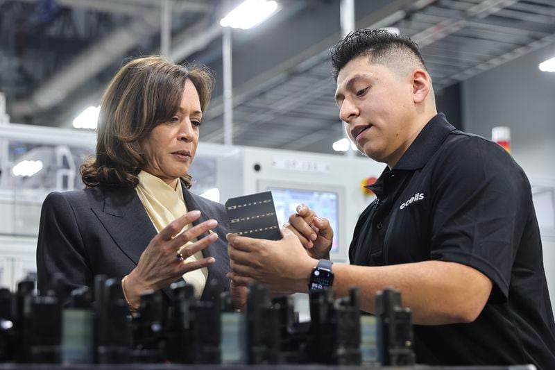 Vice President Kamala Harris tours the Qcells Factory with an employee in Dalton, Ga., on Thursday, April 6, 2023. (Natrice Miller/natrice.miller@ajc.com)
