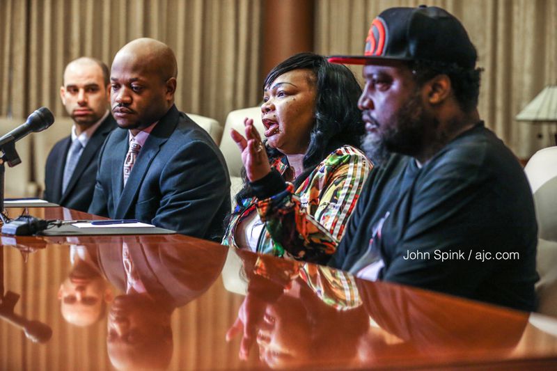 Lawyers Michael Roth (left) and Chris Stewart with LaDerihanna Holmes' parents Charlette Bolton and Derryl Holmes at a press conference two weeks ago, days after the girl was struck by a car in her front yard. (Photo: JOHN SPINK / JSPINK@AJC.COM)