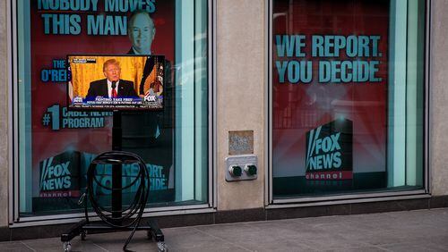 NEW YORK, NY - FEBRUARY 17: A clip of President Donald Trump's Thursday press conference is played on 'Fox And Friends', seen on a monitor outside of the Fox News studios, on February 17, 2017 in New York City. President Trump, a frequent consumer and critic of cable news, recently tweeted that Fox and Friends is 'great'. (Photo by Drew Angerer/Getty Images)