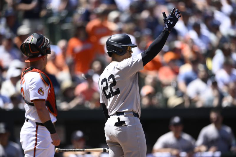 New York Yankees' Juan Soto motions towards the outfield during his at-bat in the third inning of a baseball game against the Baltimore Orioles, Thursday, May 2, 2024, in Baltimore. Orioles catcher James McCann is at left. (AP Photo/Nick Wass)