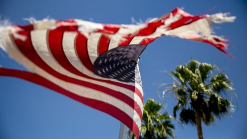 An American flag waves down the street from the El Centro Regional Medical Center on May 20, 2020, in El Centro, California. (Sam Hodgson/The San Diego Union-Tribune/TNS)