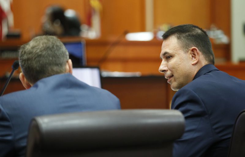 September 27, 2019 - Decatur - Prosecutor Pete Johnson (right) confers with Lance Cross during testimony this morning.  The murder trial of former DeKalb County Police Officer Robert "Chip" Olsen continued with testimony from prosecution witnesses this morning.  Olsen is charged with murdering war veteran Anthony Hill.  Bob Andres / robert.andres@ajc.com