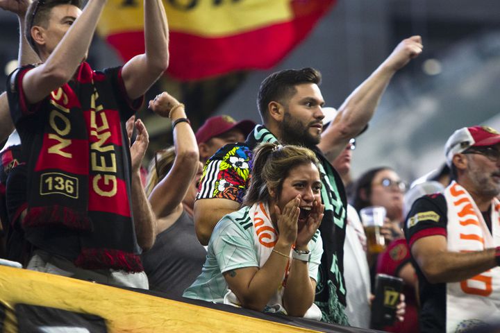 An Atlanta United fan cheers during the match. CHRISTINA MATACOTTA FOR THE ATLANTA JOURNAL-CONSTITUTION.