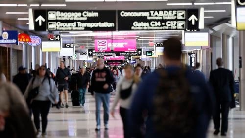 Travelers move up and down Concourse C at Hartsfield-Jackson Atlanta International Airport on Monday, March 11, 2024.
Miguel Martinez /miguel.martinezjimenez@ajc.com