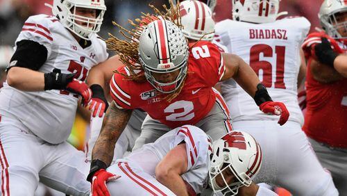 Quarterback Jack Coan #17 of the Wisconsin Badgers is sacked in the second quarter by Chase Young #2 of the Ohio State Buckeyes at Ohio Stadium on October 26, 2019 in Columbus, Ohio. (Photo by Jamie Sabau/Getty Images)