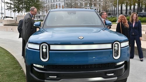 December 16, 2021 Atlanta - Guests look at Rivian R1T electric truck during a press conference at Liberty Plaza across from the Georgia State Capitol in Atlanta on Thursday, December 16, 2021. Electric vehicle maker Rivian on Thursday confirmed its plans to build a $5 billion assembly plant and battery factory in Georgia, which Gov. Brian Kemp called Òthe largest single economic development project ever in this stateÕs history.Ó (Hyosub Shin / Hyosub.Shin@ajc.com)