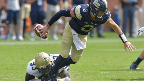 September 23, 2017 Atlanta - Pittsburgh quarterback Ben Dinucci (3) gets tackled from behind by Georgia Tech defensive lineman Antonio Simmons (93) in the second half of an NCAA college football game at Bobby Dodd Stadium on Saturday, September 23, 2017. Georgia Tech won 35 - 17 over the Pittsburgh. HYOSUB SHIN / HSHIN@AJC.COM