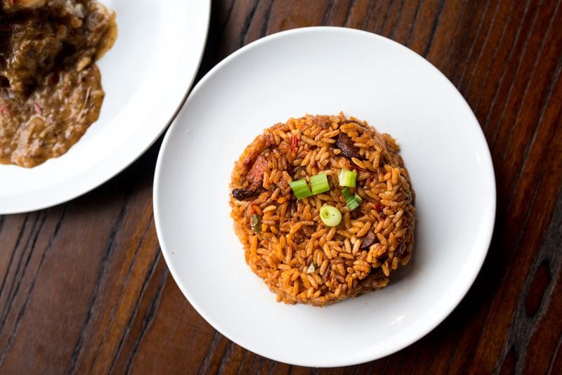 Red Rice, rice cooked in tomato sauce, bacon, and smoked sausage. Photo credit- Miai Yakel.