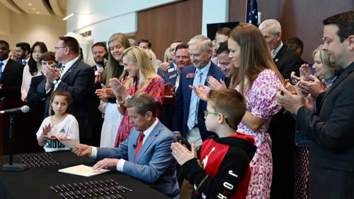 Gov. Brian Kemp signs education-related legislation in Forsyth County on April 28, 2022. Special.