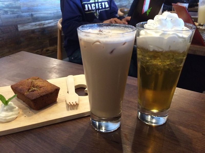 Brown-sugar milk tea and oolong con panna (with cream) are two of the delicious iced tea drinks served at Tea House Formosa on Buford Highway. Shown here with a slice of black-tea banana poundcake. CONTRIBUTED BY WENDELL BROCK