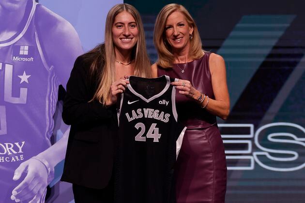 FILE - Iowa's Kate Martin, left, poses for a photo with WNBA commissioner Cathy Engelbert, right, after being selected 18th overall by the Las Vegas Aces during the second round of the WNBA basketball draft April 15, 2024, in New York. Former Iowa player Martin made the Aces opening day roster after being chosen in the second round of the WNBA draft. (AP Photo/Adam Hunger, File)
