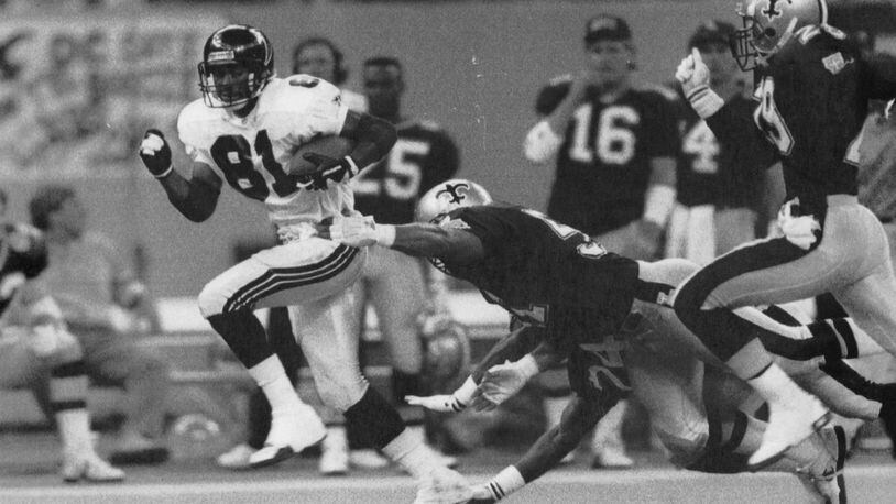 Falcons' Michael Hayes breaks away for the go-ahead touchdowns against the Saints in 1991. (AJC)