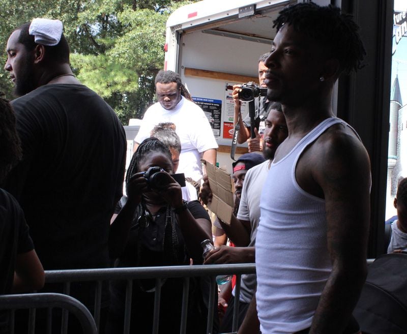 21 Savage looks out at the crowd gathered at his "Issa Back 2 School Drive." Photo: Melissa Ruggieri/AJC