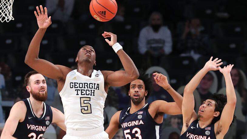021021 Atlanta: Georgia Tech forward Moses Wright battles for a rebound with Virginia defenders Jay Huff (from left), Thomas Woldetensae, and Kihei Clark in an NCAA college basketball game on Wednesday, Feb 10, 2021, in Atlanta.      Curtis Compton / Curtis.Compton@ajc.com���