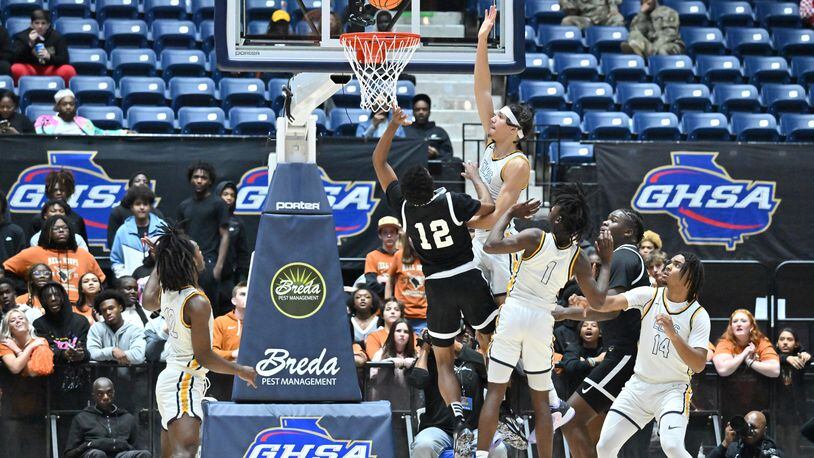 Kell’s CJ Brown (12) goes to the basket for the shot during 2023 GHSA Basketball Class 5A Boy’s State Championship game at the Macon Centreplex, Thursday, March 9, 2023, in Macon, GA. Kell won 61-53 over Eagle's Landing. (Hyosub Shin / Hyosub.Shin@ajc.com)