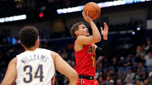 Hawks guard Trae Young (11) shoots against the New Orleans Pelicans in New Orleans, Tuesday, March 26, 2019. (AP Photo/Gerald Herbert)