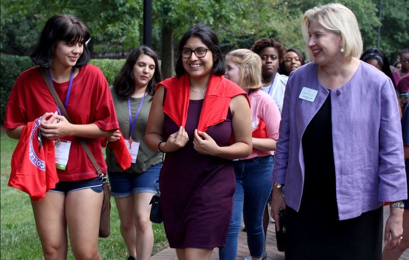 In this August 2018 file photo, Rachel de las Casas and Natalia Rosas, incoming first-year students at Agnes Scott College (left to right), talk to the president of the college, Leocadia (Lee) I. Zak, at Agnes Scott College. Though Agnes Scott has switched to online learning for the fall semester, it is not lowering its tuition. JENNA EASON / AJC FILE PHOTO