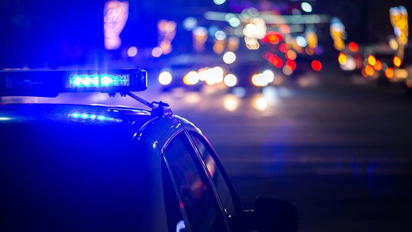 Two pedestrians were struck by an SUV on Peachtree Parkway early Friday morning. One of them died, according to authorities.
