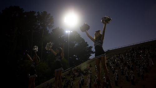 Cheerleaders raise their pom poms during a GHSA high school football game between Stephenson High School and Miller Grove High School at James R. Hallford Stadium in Clarkston, GA., on Friday, Oct. 8, 2021. (Photo/Jenn Finch)