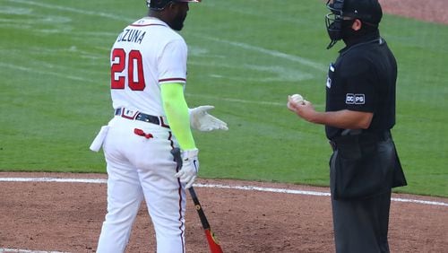 The Braves' Marcell Ozuna argues a called third strike with the home plate umpire during the fourth inning of the second game of a doubleheader against the Arizona Diamondbacks Sunday, April 25, 2021, at Truist Park in Atlanta. (Curtis Compton / Curtis.Compton@ajc.com)