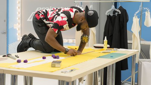 Ken Laurence working on his bold yellow dress for his final collection. CREDIT: Lifetime