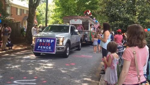Officials say this sign was not OK'd to appear in the Fourth of July parade. (Screenshot via YouTube / user Dances with Goofy)