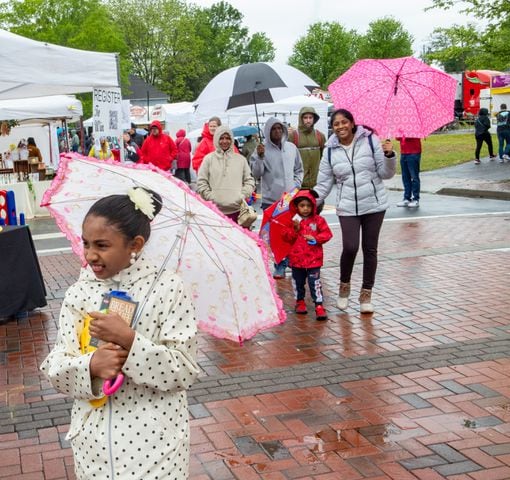 Mahitha Narenthren, 9, and her family arrive at Big Shanty Festival in Kennesaw on Sunday, April 21, 2024.  (Jenni Girtman for The Atlanta Journal-Constitution)