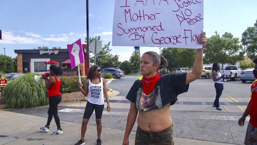 June 13, 2020 - Atlanta - Protestors gather at the Atlanta Wendy’s where Rayshard Brooks, a 27-year-old Black man, was shot and killed by Atlanta police Friday evening during a struggle in a Wendy’s drive-thru line, Steve Schaefer for the Atlanta Journal Constitution