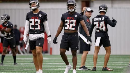 Falcons defensive backs Erik Harris (23) and A.J. Terrell (24) were ruled out of Thursday's game against the Panthers. Tight end Feleipe Franks also won't play. (Jason Getz / Jason.Getz@ajc.com)