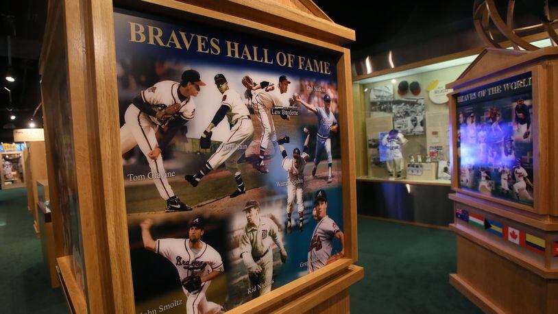 April 7, 2014 - Atlanta - New exhibits in the stadium’s Braves museum include a Braves-in-Cooperstown display. Forty years ago Tuesday night — April 8, 1974 — Hank Aaron broke Babe Ruth’s career home run record by hitting No. 715 over the fence in left-center field at Atlanta-Fulton County Stadium. New exhibits in the stadium’s Braves museum include displays celebrating the 40th anniversary of Aaron’s No. 715 and the 100th anniversary of the (Boston) Braves’first World Series championship in 1914. A Braves-in-Cooperstown display will honor 2014 National Baseball Hall of Fame inductees Bobby Cox, Tom Glavine and Greg Maddux. Ground crew members kept the infield covered in advance of Tuesday's season home opener at Turner field in Atlanta. BOB ANDRES / BANDRES@AJC.COM