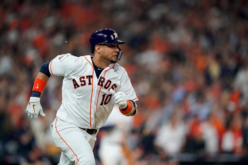 Houston Astros' Yuli Gurriel reacts hits a two-run scoring double during the first inning of Game 1 of the baseball World Series against the Washington Nationals Tuesday, Oct. 22, 2019, in Houston. (AP Photo/David J. Phillip)