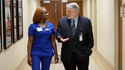 Executive Medical Director at Willowbrooke, Dr. Kenneth Genova, talks with nurse Kirsten Felton in one of the hallways of the clinic on Monday, September 18, 2022. Miguel Martinez / miguel.martinezjimenez@ajc.com 