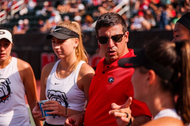Georgia associate head coach Drake Bernstein talking to players during the Bulldogs' NCAA second-round match against FSU at Henry Feild Stadium on Saturday, May 6. Bernstein has since been tabbed to succeed Jeff Wallace as head coach of UGA's storied women's tennis program. (File/Tony Walsh/UGA Athletics)