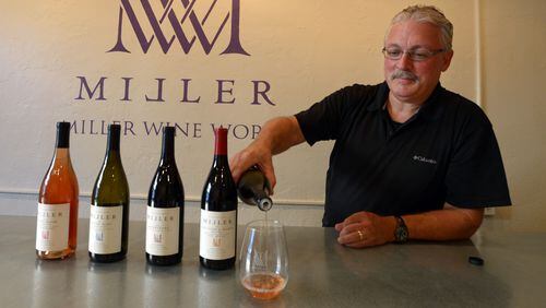 Gary Miller pours a tasting of 2012 Ruddy Bloom rose wine at Miller Wine Works on Main Street in Sutter Creek, Calif., on August 21, 2014. (Susan Tripp Pollard/Bay Area News Group/TNS)
