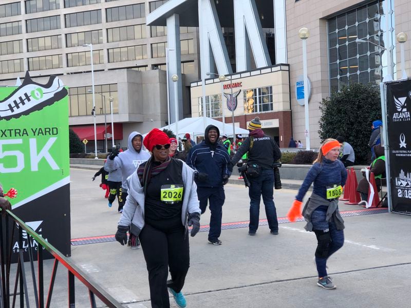 The Extra Yard 5K, the official road race of the College Football Playoff, nears its conclusion Sunday morning, January 7, 2018, at “Championship Campus” in Atlanta.