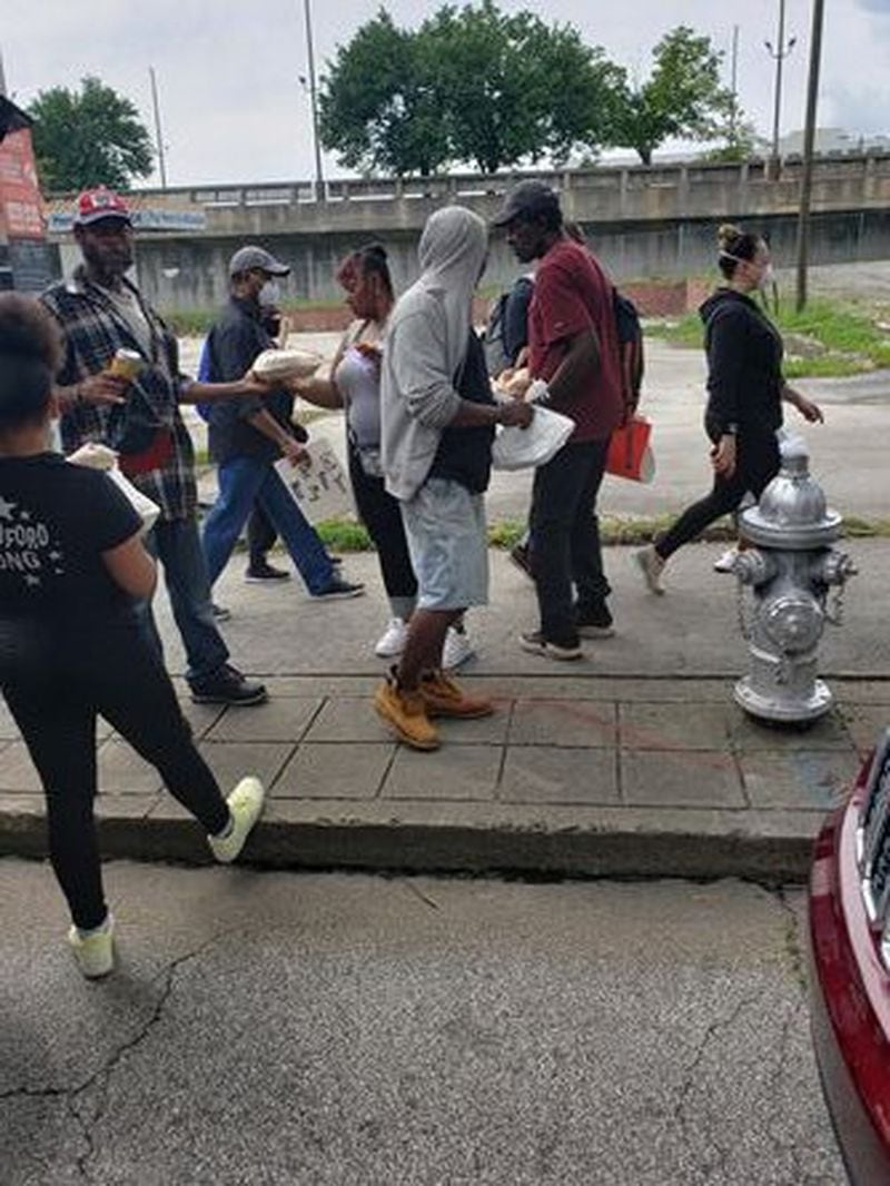 Atlantan Alexander Harris launched Empowerment Zone Encouraging Teens (EZET)about 20 years ago to help youth in inner-city Atlanta. During a recent outreach effort, members of Harris’ group prepared and handed out meals to homeless people in Atlanta. CONTRIBUTED / ALEXANDER HARRIS
